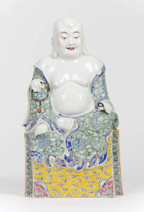 A Chinese enameled porcelain figure of seated buddha, 20th century
