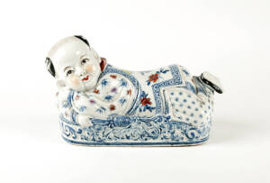 A Chinese porcelain boy pillow, 20th century