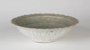 A Chinese celadon glazed barbed circular dish, Ming Dynasty, 29cm diameter, Provenance: The Royal Nanhai Cargo RN. 3971 - with certificate