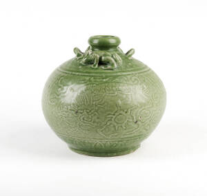 A carved green celadon jar, 20th century20cm high&nbsp;&nbsp;&nbsp;