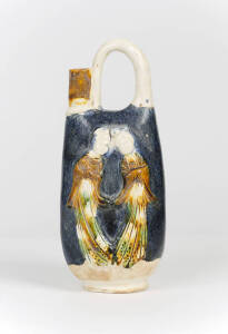 A Tang style blue ground and Sancai glazed earthenware ewer
