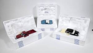 FRANKLIN MINT: Group of model cars including 1953 Cadillac Eldorado Convertible (B11RB68); and, 1968 Harley Davidson Easy Rider Chopper (B11WL73); and, 1961 Jaguar E Type Coupe (B11WR61). All mint in original cardboard packaging. (8 items)