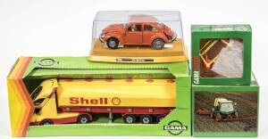 GAMA: Group of model cars including 3 piece Fire Engine (3536); and Volkswagen 1303 (0443) – Orange; and, Intrac 2005 Tractor (421). All mint in original cardboard packaging. (15 items)