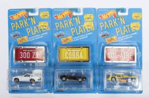HOTWHEELS: Late 1980s to early 1990s ‘Park’n Plates’ including Ferrari Testarossa (2048); and, Camaro Z28 (2179); and, ’57 T-Bird (2072). All mint and unopened in original cardboard blister packs with original licence plates. (13 items)