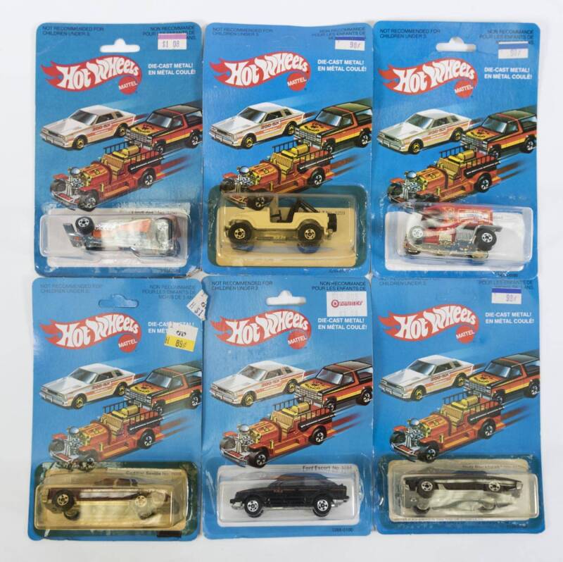 HOTWHEELS: Group of Vintage early 1980s model cars including ’35 Classic Caddy (3252); And, Ford Escort (3288); And, Pepsi Challenger (2023). All mint and unopened on original cardboard blister packs. (80 items approx.) 