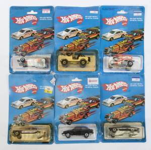HOTWHEELS: Group of Vintage early 1980s model cars including ’35 Classic Caddy (3252); And, Ford Escort (3288); And, Pepsi Challenger (2023). All mint and unopened on original cardboard blister packs. (80 items approx.) 