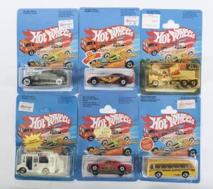 HOTWHEELS: Group of Vintage early 1980s model cars including Rolls Royce Phantom II (3290); and, XT-3 (7531); and, Delivery Van (9643). All mint and unopened on original cardboard blister packs. (29 items)