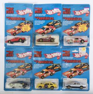 HOTWHEELS: Group of Vintage early 1980s ‘The Hot Ones’ model cars including Corvette Stingray (9241); and, Chevy Citation (3362); and, P-911 Turbo (7648). All mint and unopened on original cardboard blister packs. (95 items approx.)