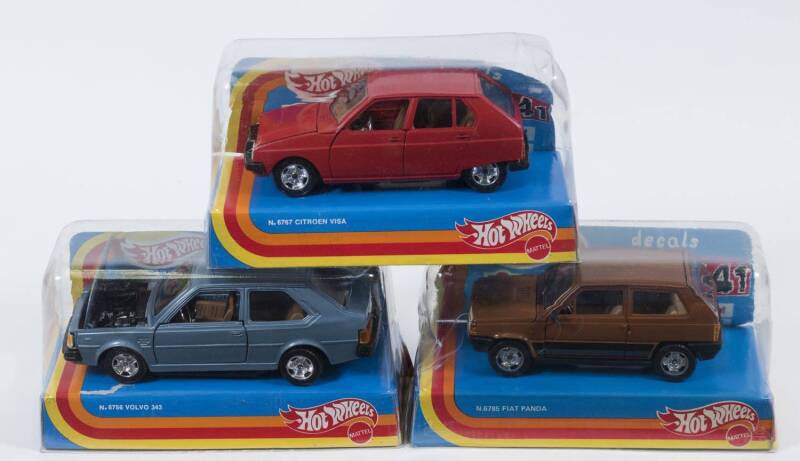 HOTWHEELS: 1:25 group of model cars including Fiat Panda (6785); And, Volvo 343 (6756); And, Citroen Visa (6767). All mint in original plastic display cases. (3 items)