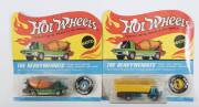 HOTWHEELS: 1970 Pair of Redline ‘The Heavyweights’ including Dump Truck (6453) – Spectral Flame Aqua Cab and Yellow Plastic Dumper; and, Cement Mixer (6454) - Spectral Flame Green Cab and Orange Mixer. Both mint and unopened in original flame blister pack