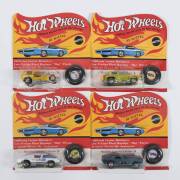 HOTWHEELS: 1971 group of Redlines including Bye-Focal (6187) – Spectral Flame Aqua; and, Ice ‘T’ (6184) – Yellow with Yellow Plastic Roof; and, Short Order (6176) – Spectral Flame Yellow. All mint and unopened in original flame blister packs. (4 items)