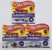 HOTWHEELS: 1971 group of Redline &lsquo;The Heavyweights&rsquo; including Team Trailer (6019) &ndash; Spectral Flame Red Cab and White Plastic Trailer; and, Racing Rig (6194) &ndash; Enamel White Cab with White Plastic Trailer; and, Team Trailer (6019) &ndash; Enamel White Cab with Wh