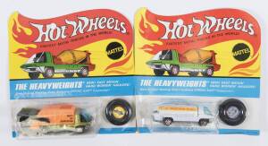 HOTWHEELS: 1971 pair of Redline ‘The Heavyweights’ including Fuel Tanker (6018) – Enamel White Cab and White Plastic Trailer; and, Waste Wagon (6192) – Spectral Flame Olive Cab with Orange Plastic Trailer. All mint and unopened in original flame blister p