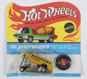 HOTWHEELS: 1971 Redline ‘The Heavyweights’ S’Cool Bus (6468) – Yellow with Silver Base, also has S’Cool Bus Stickers. Mint but is opened still with its original flame blister pack. Note it appears the blister pack glue has degraded and come off and has no
