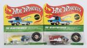 HOTWHEELS: 1971 pair of Redline ‘The Heavyweights’ including Scooper (6193) – Spectral Flame Blue Cab and Yellow Plastic Trailer; and, Snorkel (6020) – Spectral Flame Red Cab with Red Plastic Snorkel. All mint and unopened in original flame blister packs.