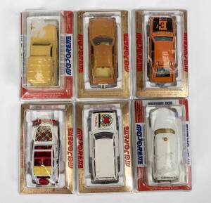 MAJORETTE: Group of model cars and oher vehicles including Bertone Camargue (221); and, Benne Bascul (252); and, Volkswagen 1302 (202). All mint in original bubble packs. (14 items)