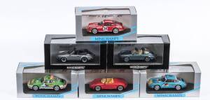 MINICHAMPS: 1:43 group of Porsche model cars including 1983 Porsche 911 Carrera Cabriolet (62032) - Blue Metallic; and, 1994 Supercup Porsche 911 (946324) – J.P.Malcher; and, Porsche Boxster (63132) – Red. All mint in original perspex display case. (32 it