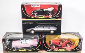 SOLIDO: 1:18 group of model cars including Ford Roadster (8008) – Red; and, 1955 Cadillac Eldorado (8011) – Pink; and, Volkswagen Coccinelle (8014) – Black. All mint in original windowed cardboard boxes. (4 items)