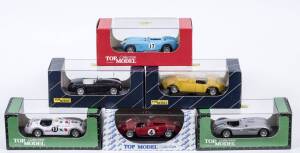 TOP MODEL: 1:43 group of model cars including Gordini T245 Carr (TMC121) - Blue; and, Ferrari 340 Vignale (TMC040B) - Red; and, Jaguar C-Type 1953 Le Mans Winner (TMC030) - Dark Green. All mint in original perspex display cases. (16 items)