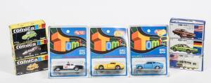 TOMICA: Group of model cars Including Komatsu Dozer Shovel D65S (106); and, Toyota Land Cruiser (2) – Tan Brown; and, Cadillac Ambulance (F2). All mint in original blister packs or cardboard boxes. (90 items)