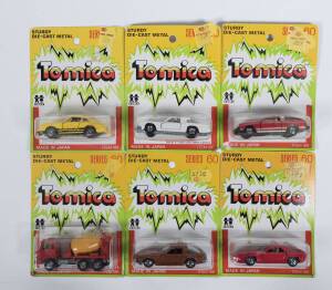 TOMICA: Group of model cars including Lotus Elite (F47); and, Oldsmobile Tornado XSR (F54); and, Toyota Car-Transporter (14). All mint and unopened in original cardboard blister packs. (375 items)