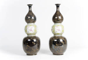 A very decorative pair of famille verte gilt and black ground triple border vases, 20th century