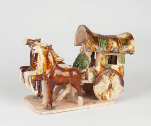 A Tang style Sancai glazed horse drawn carriage