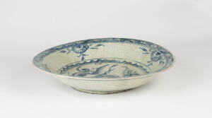 A large Swatow blue and white decorated circular dish, 17th Century; 38cm diameter