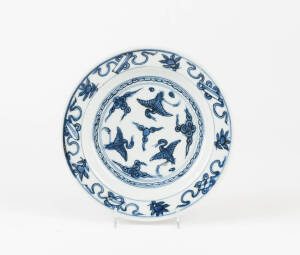 A Chinese blue and white porcelain circular dish, Ming Dynasty 16th century, painted with cranes and emblems, 20cm diameter