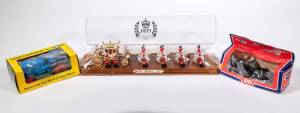 CRESCENT: group of model vehicles consisting of 1977 The Queen Silver Jubilee Royal Stage Coach (302); and, Army 25 PDR Light Artilery Gun (1250); and, Dexta Tractor (1809). All in original perspex display case/cardboard windowed box. Note there is some d