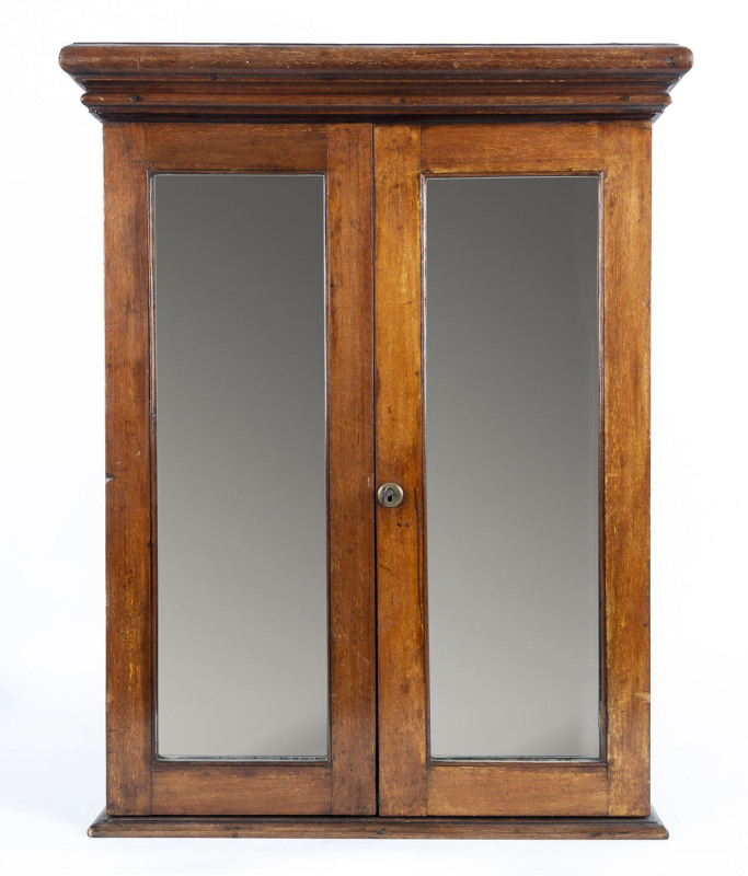 An Australian cedar medicine cabinet with mirrored doors, 19th century