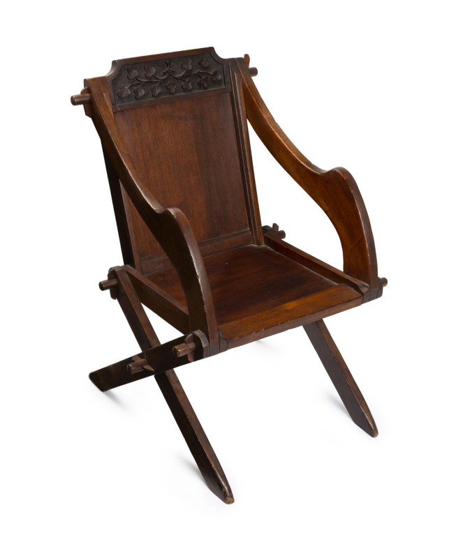 An Australian Arts and Crafts chair, carved cedar, Victorian origin, late 19th century stamped "W. STOW, MAKER, SALE"