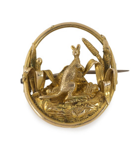 An Australian 18ct yellow gold brooch depicting a kangaroo amongst grass trees in landscape, circa 1850s 3 x 2.5cm, 5.1 grams