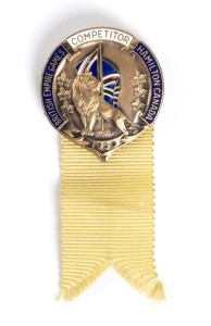 1930 1st BRITISH EMPIRE GAMES IN HAMILTON, Competitor's badge enamelled with "Competitor/British Empire & Commonwealth Games/ Hamilton, Canada/1930", yellow ribbon, 32mm diameter. Ex Harry Brittain Fry, a Canadian rower who also competed in the 1932 and 1