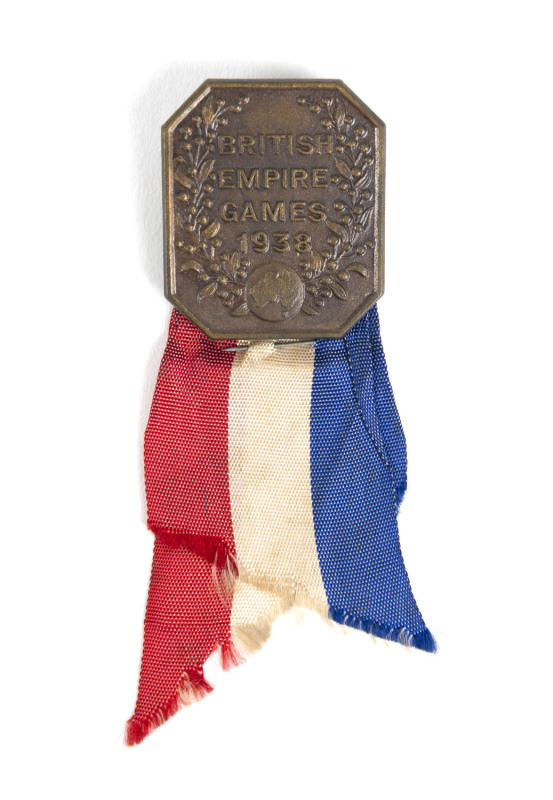 1938 COMMONWEALTH GAMES IN SYDNEY, Official's badge "British Empire Games 1938", 28x32mm, with red, white and blue ribbon.