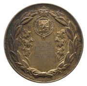 1958 BRITISH COMMONWEALTH GAMES IN CARDIFF, Gold Winner's Medal, engraved on reverse "ROWING/FOUR-OAR/SHELL/(COXS'LESS)", hallmarked silver gilt, 54mm diameter, 80.88 grams.