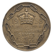 1958 BRITISH COMMONWEALTH GAMES IN CARDIFF, Gold Winner's Medal, engraved on reverse "ROWING/FOUR-OAR/SHELL/(COXS'LESS)", hallmarked silver gilt, 54mm diameter, 80.88 grams. - 2