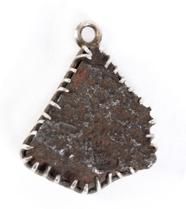 WW1 Period pendant made from a piece of shrapnel mounted in silver