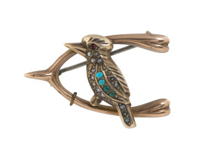 A 9ct rose gold kookaburra brooch set with turquoise, seed pearls and ruby eye