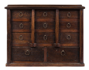 An unusual 11 drawer miniature chest with turned columns, stained pine and packing crate, 1890s depression era