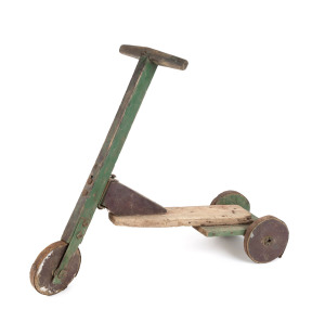 A depression era scooter, painted wood and iron, circa 1930s