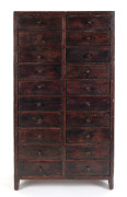 A miniature chest of 20 drawers, stained pine, drawers fitted with various compartments, circa 1900