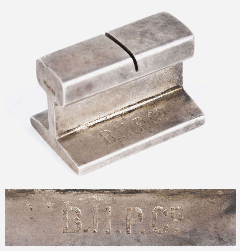 An Australian silver B.H.P. presentation name card holder in the form of a section of railway track engraved "B.H.P. Co. LUNCHEON TO JOHN DARLING 14/3/13" by William Drummond & Co. Melbourne