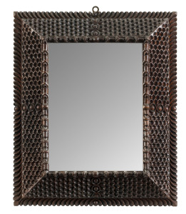 A tramp art framed mirror, finely carved cedar, circa 1890