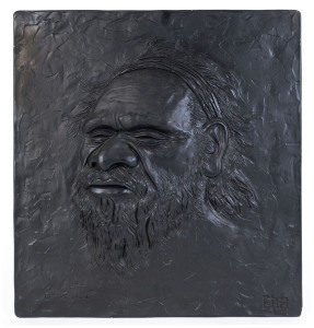 "DESERT MAN" Plaque, ebonized plaster, mid 20th century