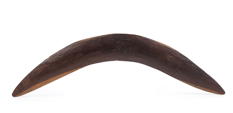 A boomerang, finely carved with remains of ochre, Western Australia origin