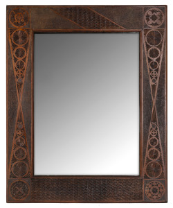 A tramp art framed mirror, chip carved stained kauri pine, late 19th century