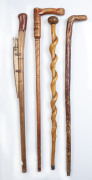 Four assorted walking sticks including Maori carved and crocodile carving, 20th century - 2