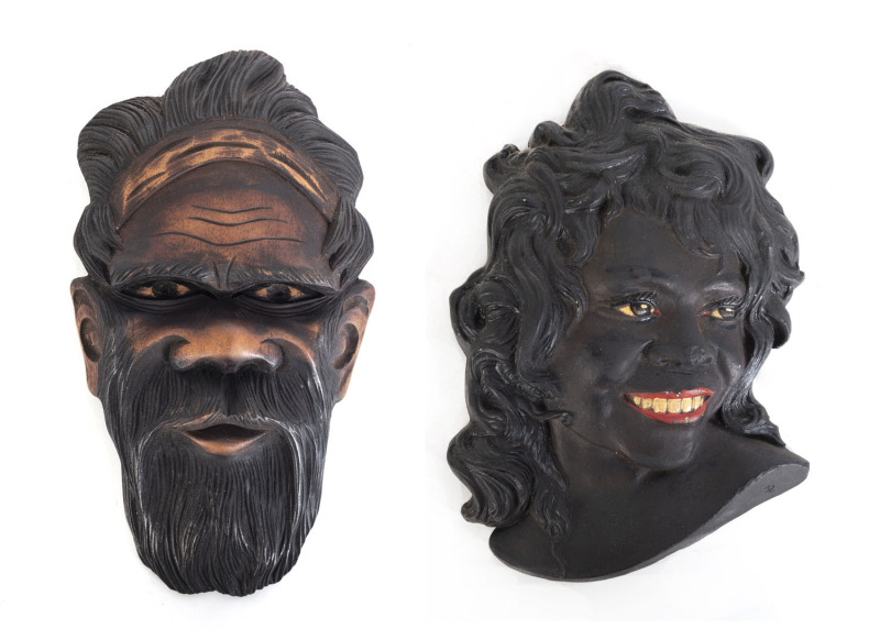 Two Aboriginal face plaques, carved wood and plaster, mid 20th century