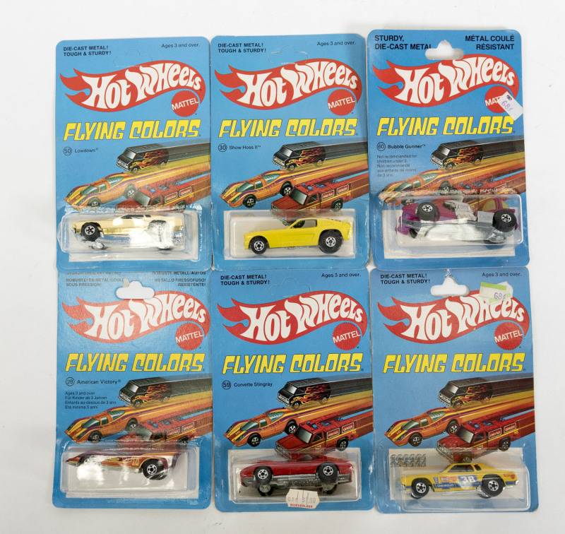 HOTWHEELS: Vintage late 1970s to early 1980s ‘Flying Colors’ including Top Eliminator (7630) – chrome; and, Race Bait 308 (2021) – red; and, Hiway Hauler (1174) – North American Van Lines. All mint and unopened on original cardboard blister packs. (65 ite